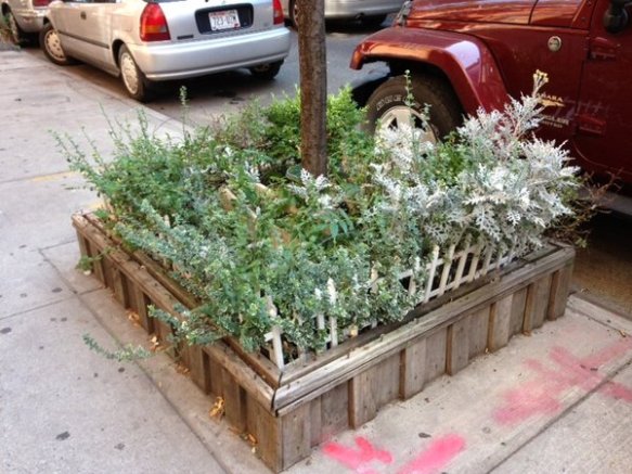 wooden bed with white fencing