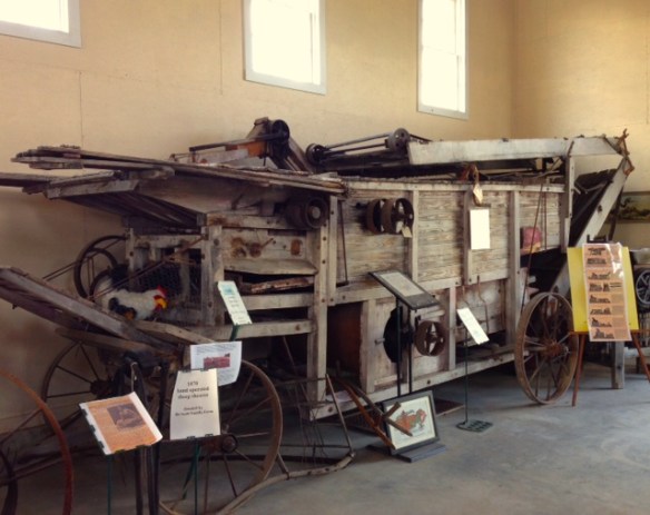 An old grain thrasher from the late 1800's on display